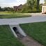 Concrete drain pipe under a residential driveway