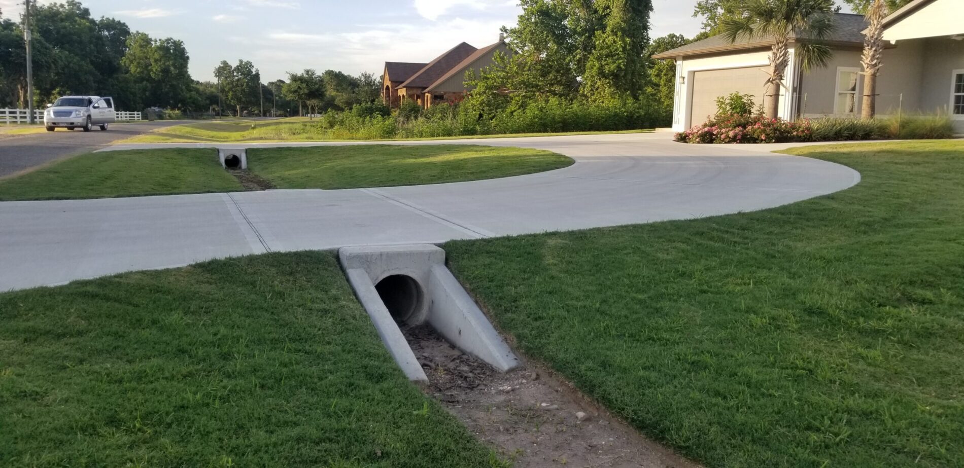 Concrete drain pipe under a residential driveway
